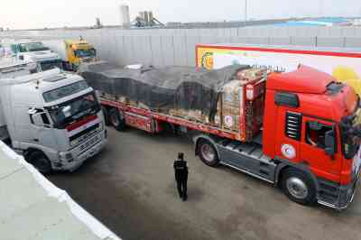 Trucks carrying humanitarian aid for Gaza have crossed the Rafah border gate in Egypt