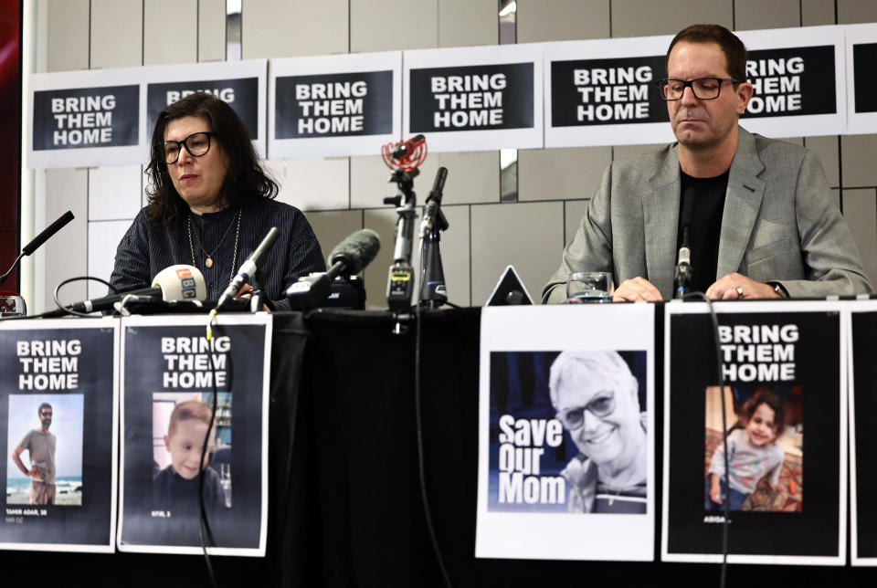 London-based British-Israelis, Noam Sagi (R) and Sharon Lifschitz, whose respective parents were taken hostage from the Nir Oz Kibbutz during the surprise attack on Israel by the Palestinian militant group Hamas, attend a press conference hosted by Defend Israeli Democracy UK, in London on October 12, 2023.