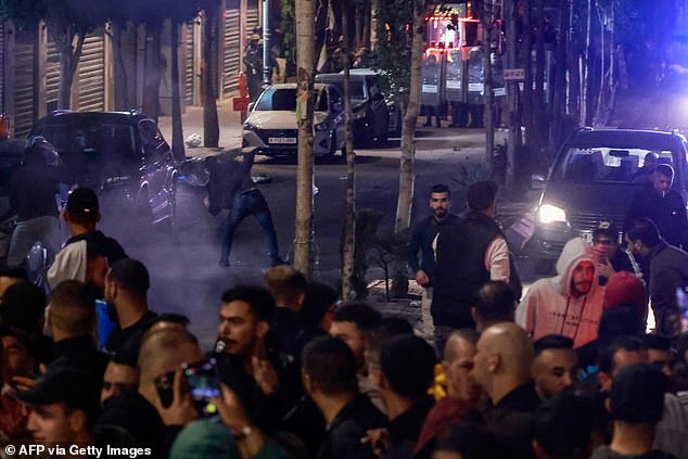 Demonstrators are seen flooding the streets of Ramallah on Tuesday evening in support of the Palestinians of the Gaza Strip