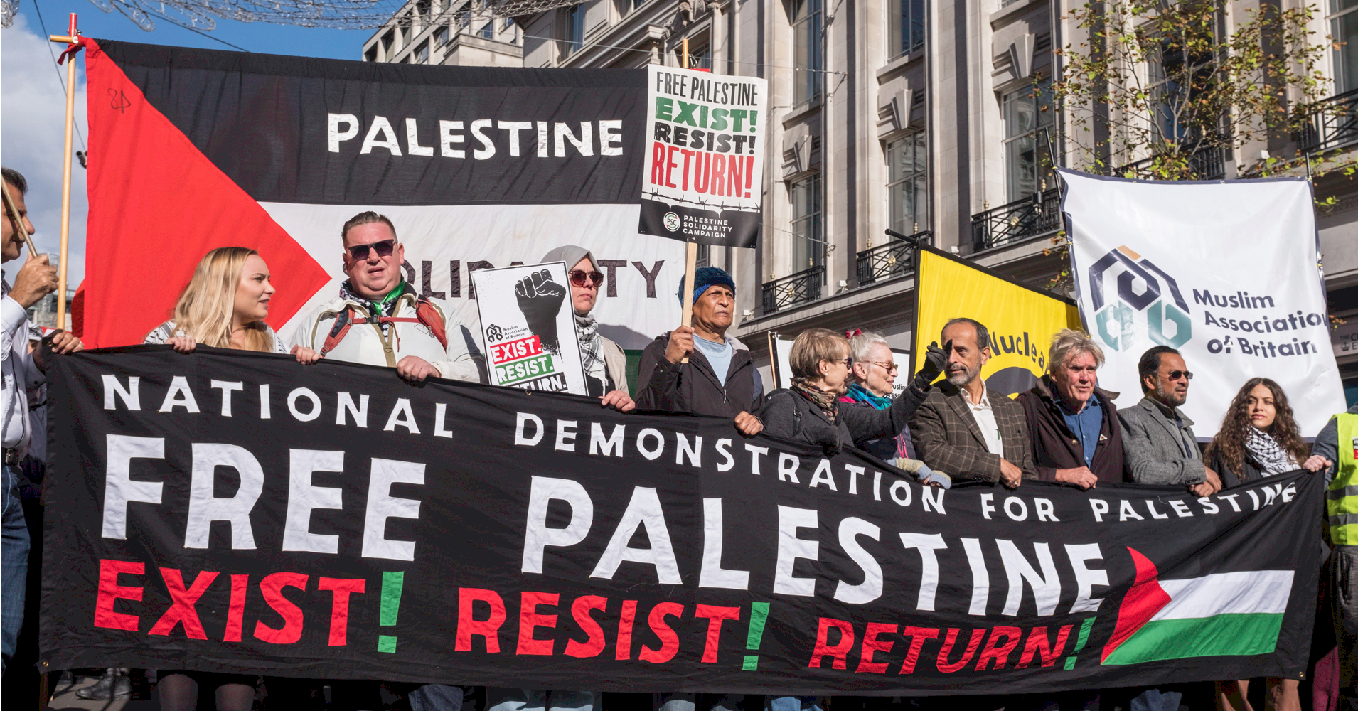 Marchers in London hold a banner saying 