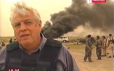 Simpson reporting after a bomb was dropped just yards from where he was standing, killing 18 people, near Mosul, northern Iraq in 2003