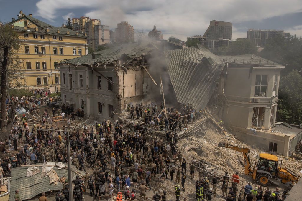 Emergency and rescue personnel clear the rubble from the Okhmatdyt children's hospital, which was destroyed in a Russian missile attack