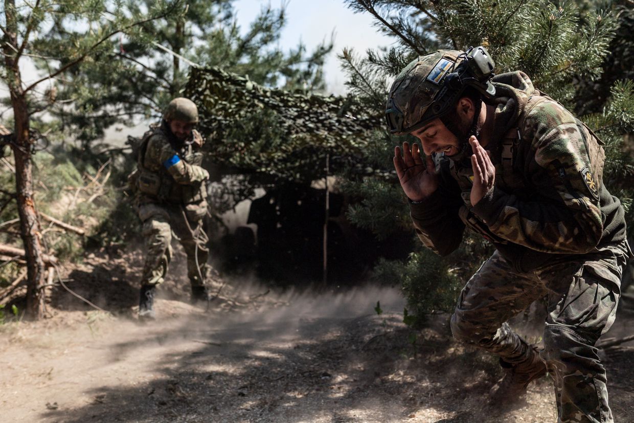 A Ukrainian soldier of the Khartia Brigade, a military unit of Ukrainian National Guard, fires the D-20 artillery towards the direction of Kupiansk,