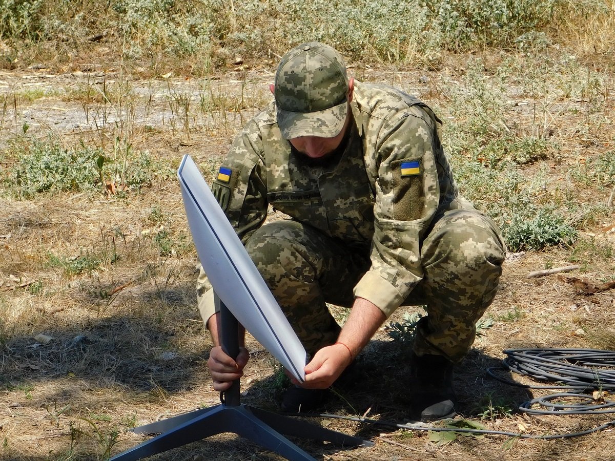 A Ukrainian soldier installs Starlink. Photo: Armed Forces of Ukraine