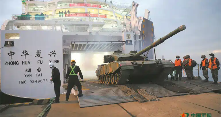 Chinese main battle tanks are loaded onto the commercial ferry Zhong Hua Fu Xing. Photo: China Military Online